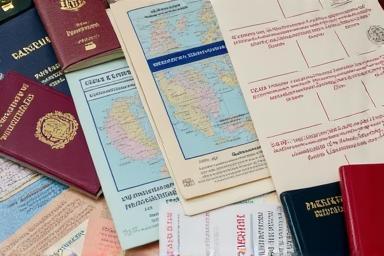 Stack of passports, visas, and other essential travel documents
